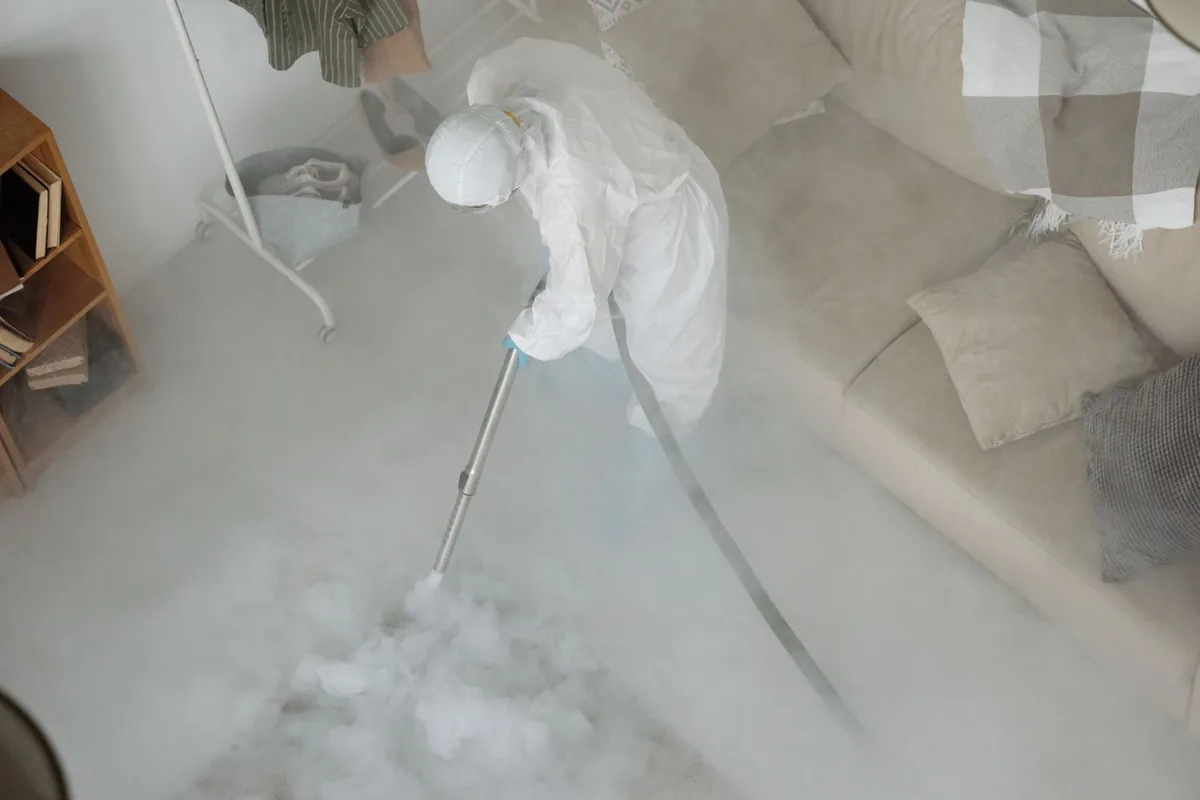 Biohazard cleanup technician in protective equipment, The Pinehills, MA